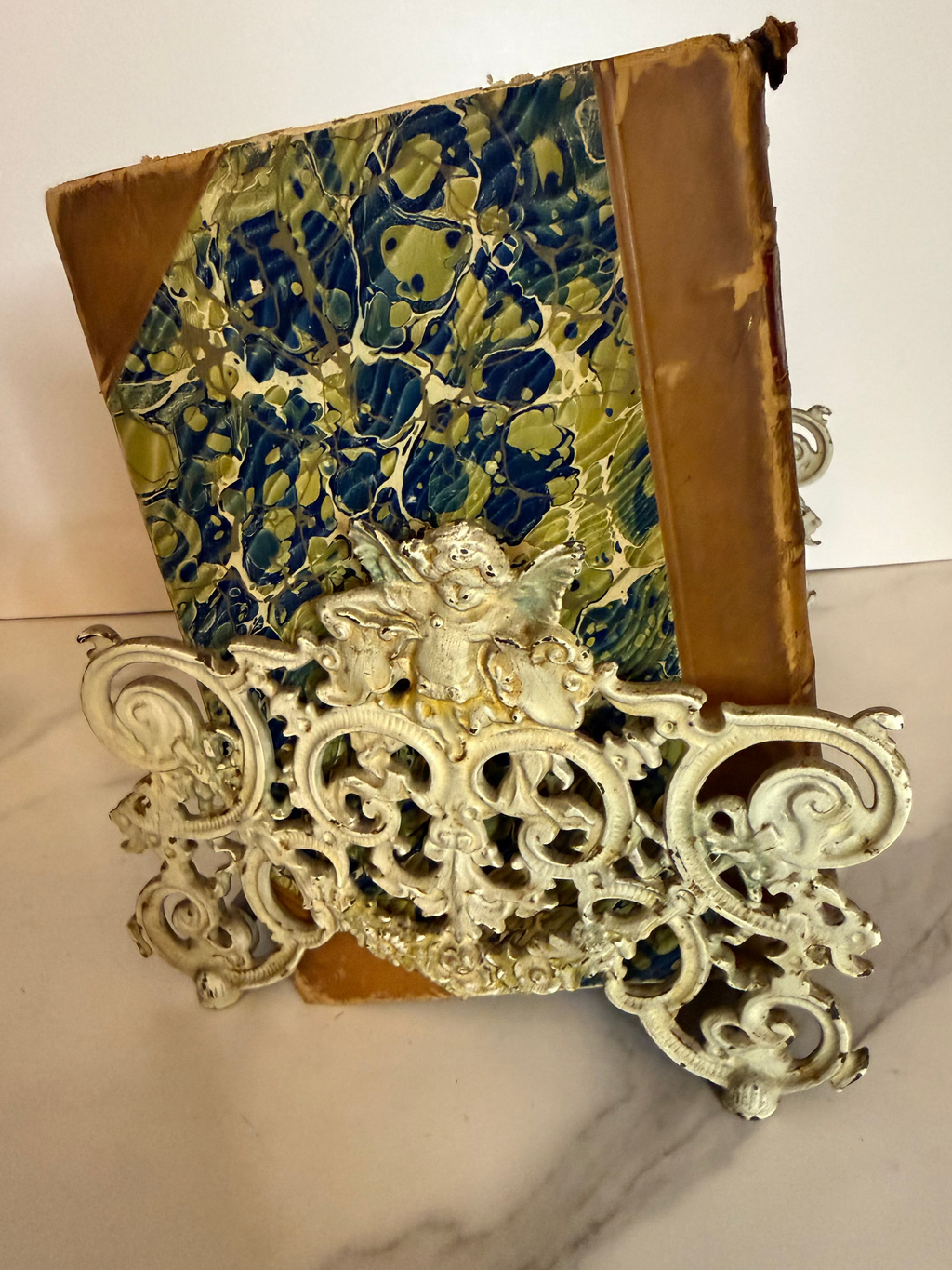 Decorative bookend with intricate design on a marble surface